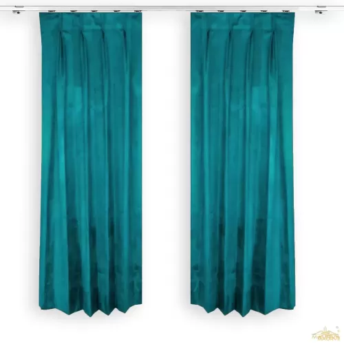 A pencil pleat curtain hangs in a room.
