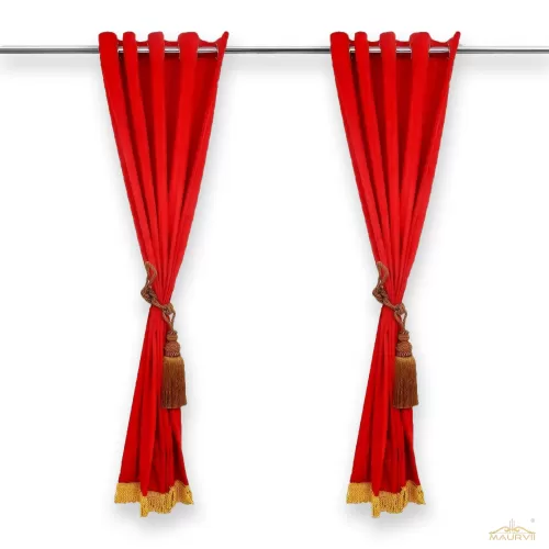 Curtains made of red velvet with tassels