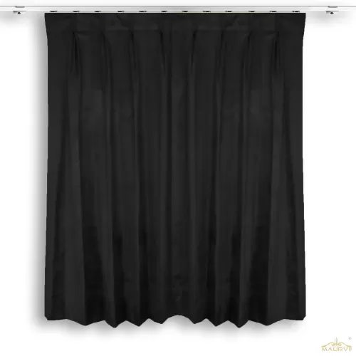Black velvet made drapes hooked in a room 