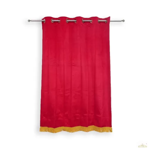 Golden fringed red velvet curtains