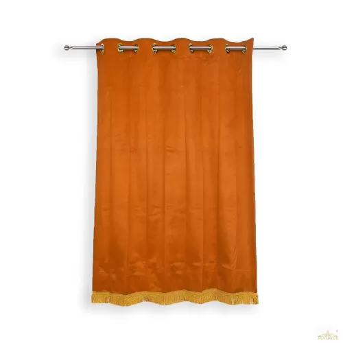 Rust Velvet Curtains with bottom fringe.